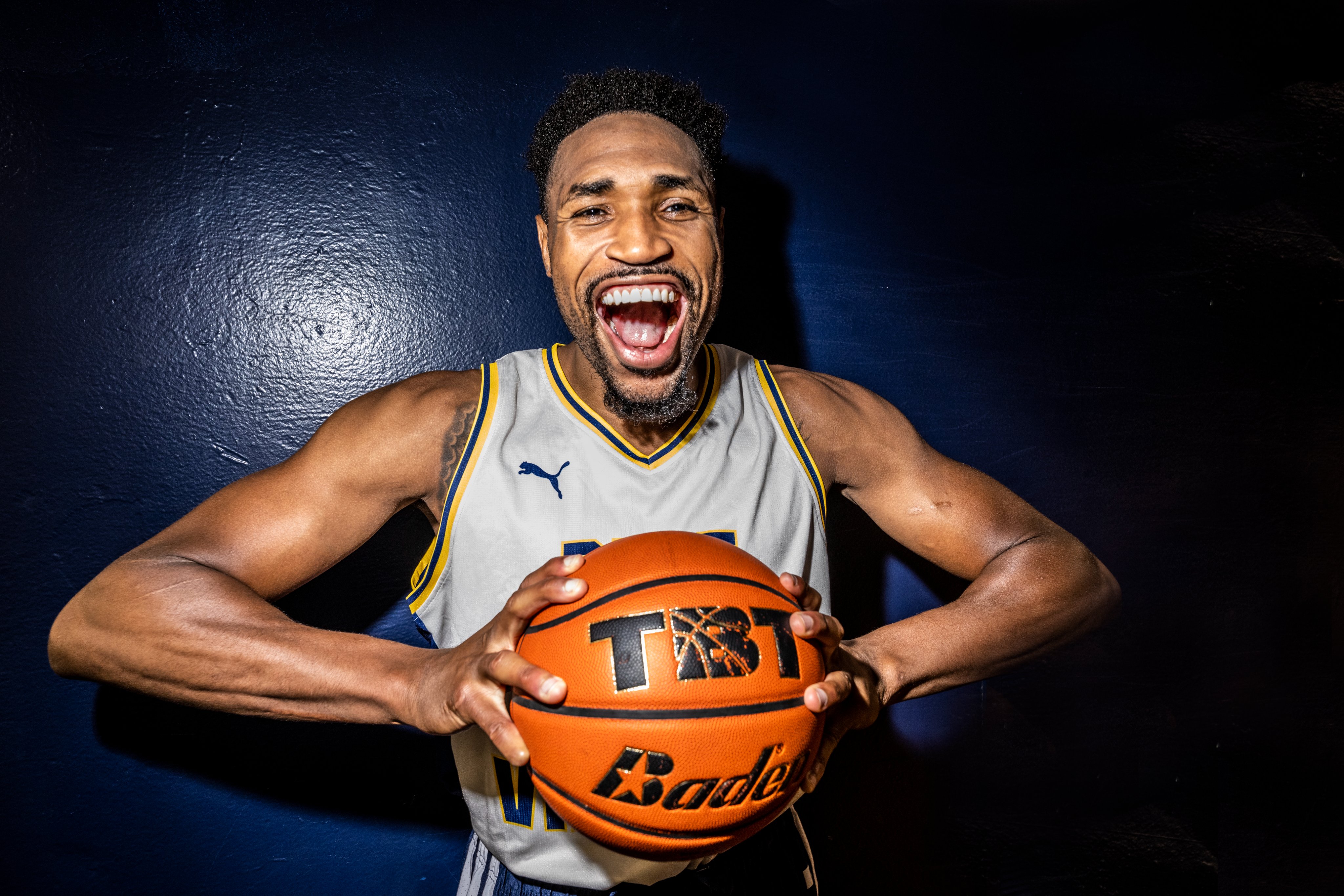 Kevin Jones poses with the basketball